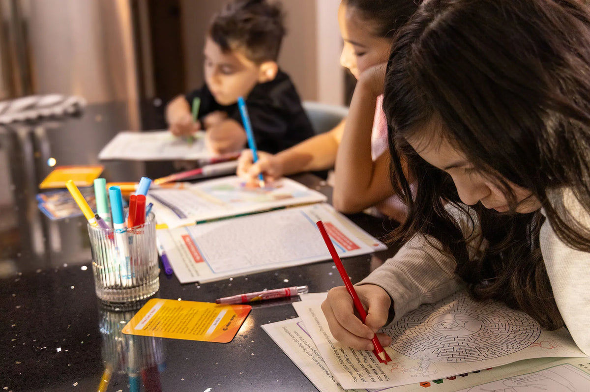 Child coloring in a Learn, Grow and Go! activity book